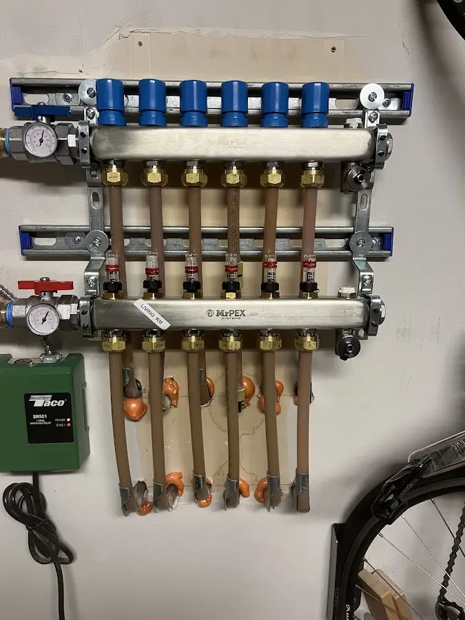 Plumber performing Water Heater Repair at a residential property in Coffeyville